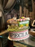 Load image into Gallery viewer, Bunny with Wagon of Flowers on Oval Box
